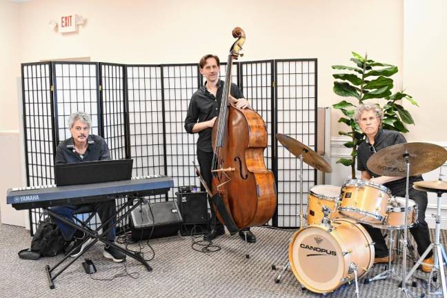 <b>FC3 The Skye Jazz Trio performs at the grand opening June 1.</b>