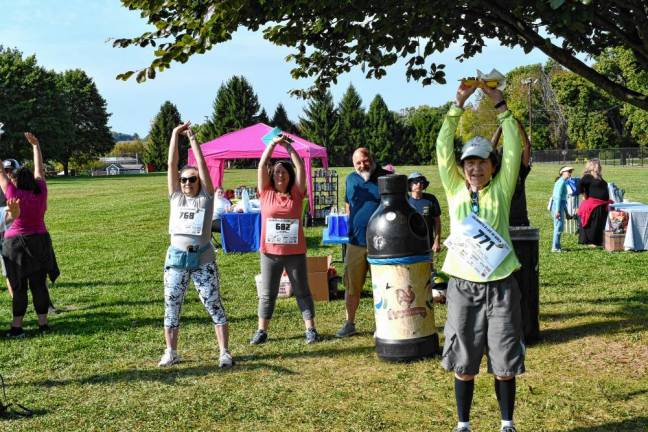 <b>Participants stretch before the walk begins.</b>