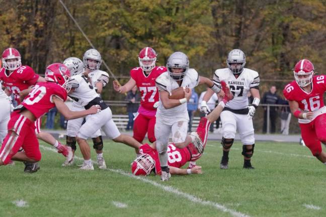 Wallkill Valley ball carrier Gabe Uy-Garcia moves forward in the first half. He scored one rushing touchdown against Lenape Valley.