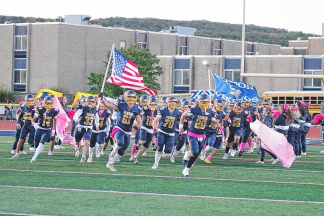 <b>The Vernon Township High School football team make a grand entrance onto the field Oct. 11.</b>