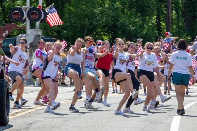 Students at the Ziegler Dance Centre in Vernon show off their moves. They followed a pickup truck playing energetic music for them to dance to.