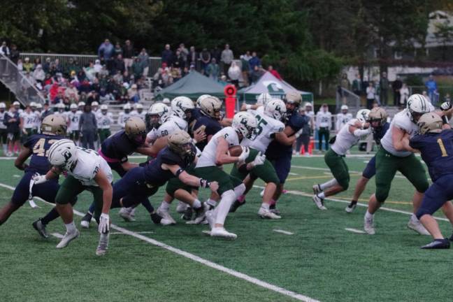 Delbarton ball carrier Ryan Trafford moves through a maelstrom of bodies in the first half. Trafford gained 146 yards on the ground and scored three touchdowns.