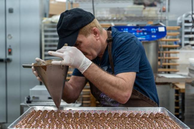 Asad Hana makes over a 1000 Nonpareils a day.