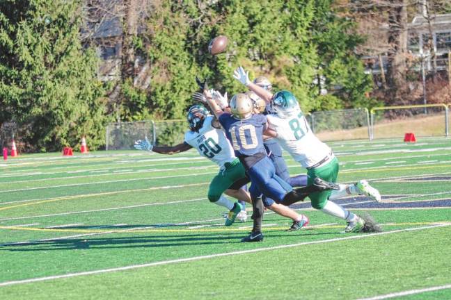 <b>The ball is up for grabs as the Camden Catholic Irish and Pope John Lions reach for it. (Photo by George Leroy Hunter)</b>