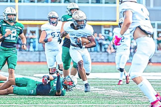 <b>Tylik Hill looks to his left after breaking a tackle on a run from scrimmage in the game against Delbarton on Oct. 5.</b>