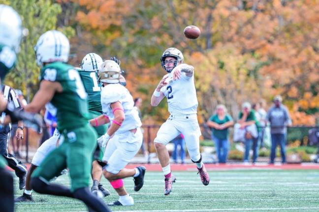 <b>Pope John quarterback Luke Irwin zips a pass downfield during second-quarter play. (Photo by Glenn Clark)</b>