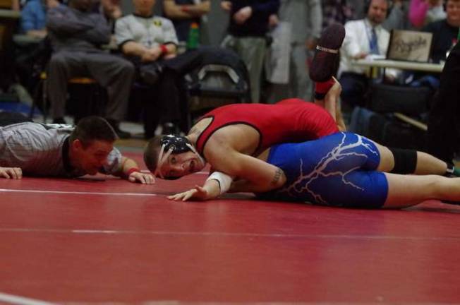 In Saturdays finals High Point's Mike Derin glances at the clock while trying to pin Warren Hills Max Nauta. Derin won the 132 lbs match in 1:36 and was named Region 1's Outstanding Wrestler.