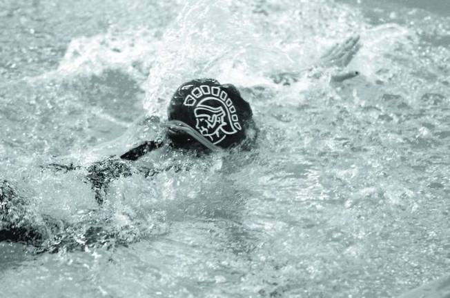 The Sparta Spartan emblem emblazons the cap of a Sparta High School female swimmer.