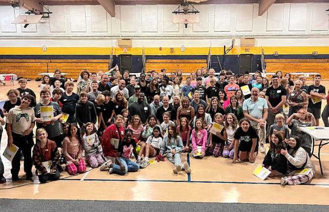 <b>Local business owners pose with Glen Meadow Middle School students in the TREP$ program. </b>