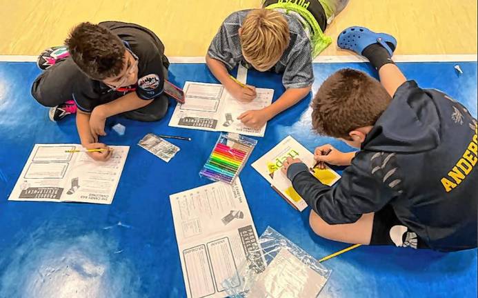 <b>Glen Meadow Middle School students work on a TREP$ project. (Photo provided)</b>