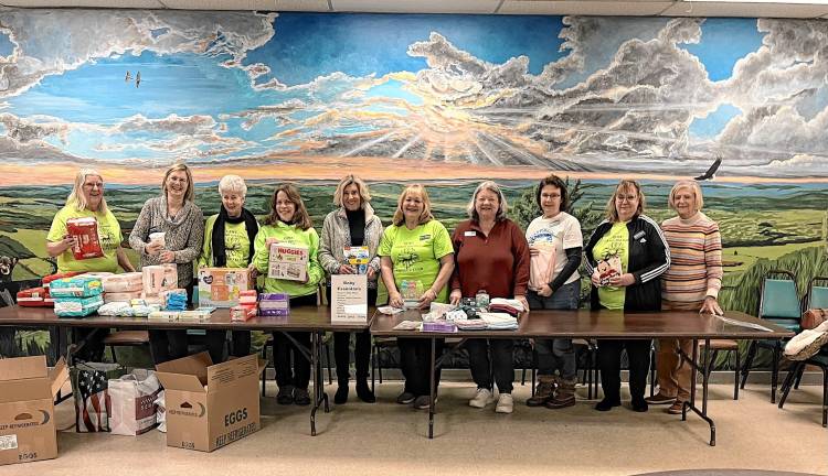 <b>Volunteers sorting donated baby items are Elaine Hossfield, Fran Gialanella, Karen Breese, Lisa Mills, Karen Jeisi, Maria Dorsey, Nancy Levy, Meg Gleason, Deb Fegnan and Connie Rosniak, president of the Thursday Morning Club.</b>