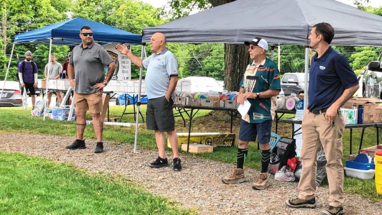 <b>Deputy Mayor Ron Bassani, second from left, speaks at the official opening of Wantage’s disc golf course. From left are Wantage Administrator Michael Restel, Dan Doyle and Joshua Simmons.</b>