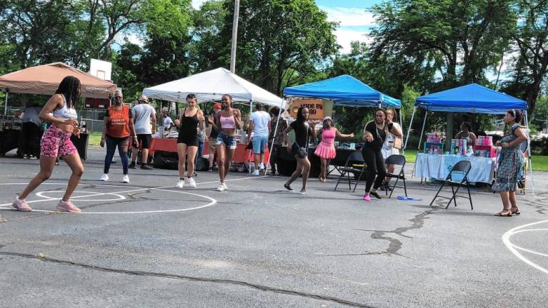 Resident dance during the Juneteenth Celebration. The event also included vendors and community organizations.