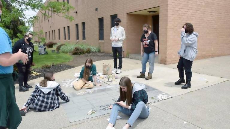 Period 8 photography class works on a cyanotype class mural: Kenny Coffaro, Alyssa Davis, Trinity Hartung, Gwen Kraemer, Katie Yates, Tyler Pullins, Carole Loeffler, and Connor Rockwell (Photo by Laura J. Marchese)