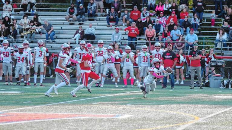 <b>High Point defensive back Brendan Lehman (21) catches the ball for an interception during the final seconds of the game at Lenape Valley on Friday, Oct. 11. The Wildcats won, 21-14. (Photos by George Leroy Hunter)</b>